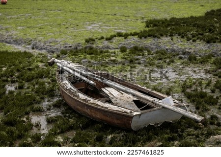Abandoned fishing boat on the marshlands of Fuseta village, Portugal.