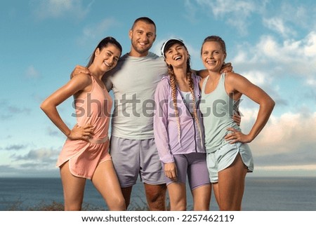 Certified instructor and his team of trainees. Download high resolution photo smiling women and man fitness team. A happy group of runners rest after running.