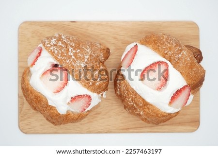 Creating delicious bread image with whipped cream and strawberries