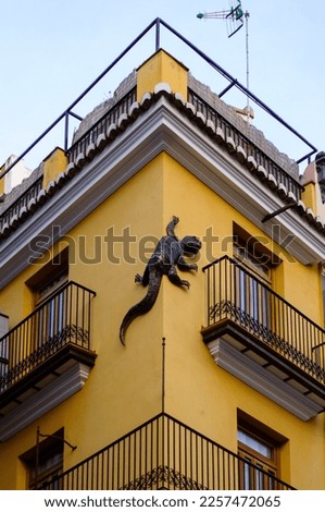 Yellow house with salamander on its corner. Valencia, Spain