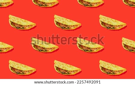 Pattern of corn tortilla tacos stuffed with vegetables and meat on a red background. Traditional Tex-Mex dish