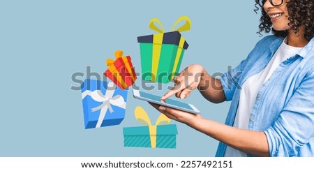 Happy african american curly lady in casual laughing while holding tablet computer with present gift boxes isolated over blue background. Trend vector illustration collage.