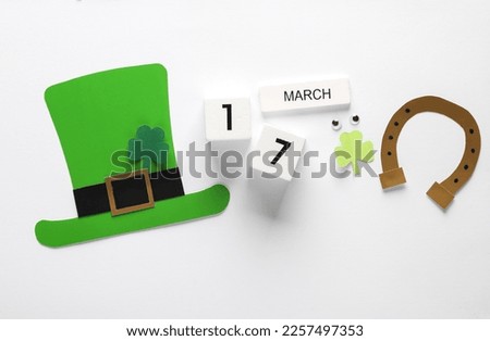 St.Patrick 's Day. Calendar with date march 17 with holiday themed handmade decor on white background. Flat lay. Top view