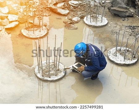 Seismic test on concrete pile.Engineer checking the integrity of the pile.Site construction work Royalty-Free Stock Photo #2257499281