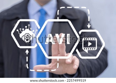 Businessman using virtual touchscreen presses abbreviation: AVI. Concept of AVI Audio Video Interleaved Business Technology.