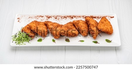 Homemade chicken nuggets on white background. Healthy and delicious food. Photo for the menu.