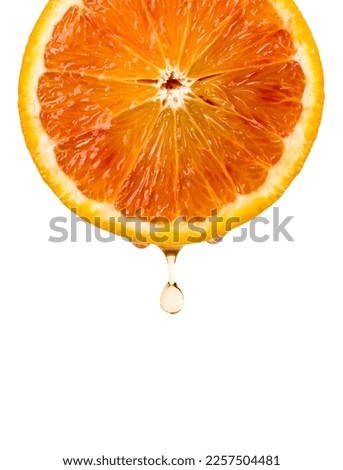 Orange fruit sliced closeup with drops, isolated on white background.