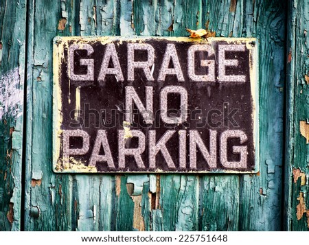 no parking sign at a garage