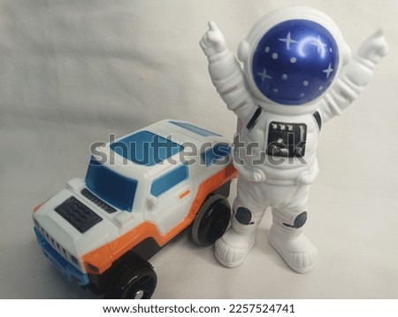 car and astronaut doll toys
