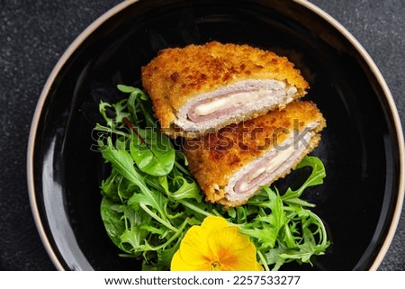 cutlet cordon bleu chicken meat, cheese, bacon healthy meal food snack on the table copy space food background rustic top view Royalty-Free Stock Photo #2257533277