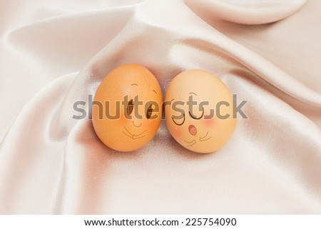 Eggs in Expression Face on satin and Colorful Background