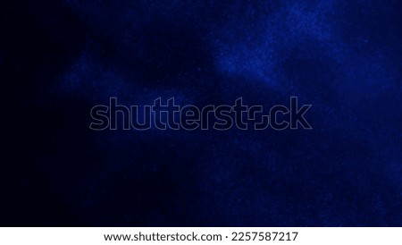 Abstract magic galaxy background. White glitter particles on a dark blue background with blue hues. Tints of white and blue dust particles magical stains with depth of field. Royalty-Free Stock Photo #2257587217