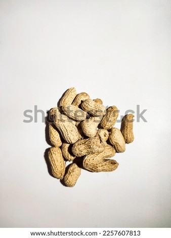 top view of peanuts isolated on white background 