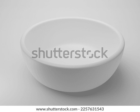 Empty white bowl on white background Royalty-Free Stock Photo #2257631543