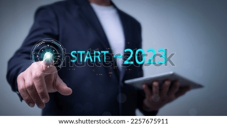 Businessman touching on virtual screen start button new start up business concept.