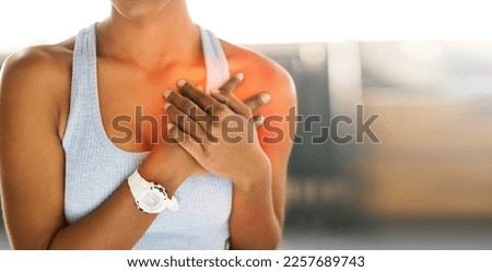 Hands, heart attack and health with a sports woman suffering from cardiac arrest outdoor during a workout. Fitness, chest pain and emergency with a female athlete holding her body for cardiology Royalty-Free Stock Photo #2257689743