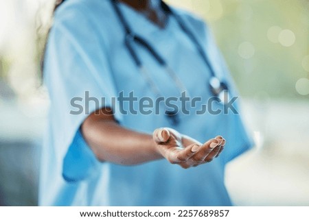 Healthcare, doctor or nurse with helping hand giving support, health care and volunteer work in hospital in Africa. Black woman medical worker, stethoscope and hands in trust working charity clinic.