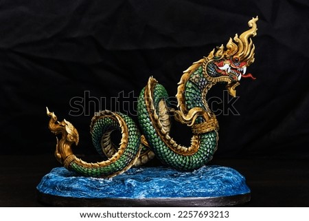 King of naga, naka  Thailand dragon or serpent king in the dark Royalty-Free Stock Photo #2257693213