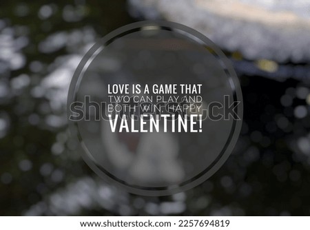 Valentine's Day quote series, Love Is A Game with a blurred natural backdrop