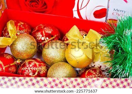 Gifts in festive packaging, decoration for Christmas tree, shiny balls with bows