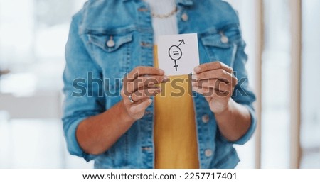 Gender equality, pay gap and woman with a sign in the office with a female and male symbol. Business, equity and girl employee with a feminism card in protest for equal salary, opportunity and equity