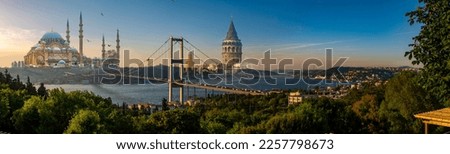 Istanbul Bosphorus panoramic photo. Istanbul landscape beautiful sunset with clouds Suleymaniye mosque and Galata Tower double exposure, Bosphorus Bridge,  Istanbul Turkey. Royalty-Free Stock Photo #2257798673