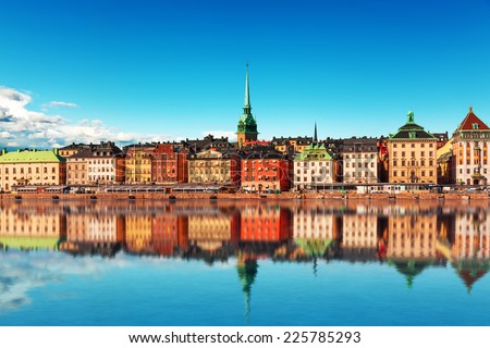 Scenic summer panorama of the Old Town (Gamla Stan) pier architecture in Stockholm, Sweden Royalty-Free Stock Photo #225785293