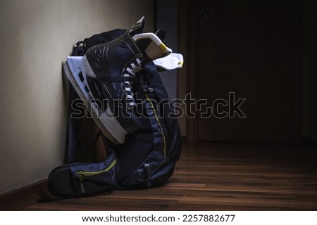 Skates hanging on a backpack