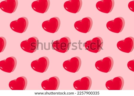 Valentines day creative pattern with bright red hearts on pastel pink background. 80s or 90s retro fashion aesthetic love concept. Minimal romantic idea. Royalty-Free Stock Photo #2257900335