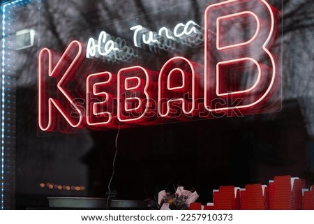 Turkish Kebab fast food restaurant window neon sign Kebab A la Turca (english: Turkish style kebab).