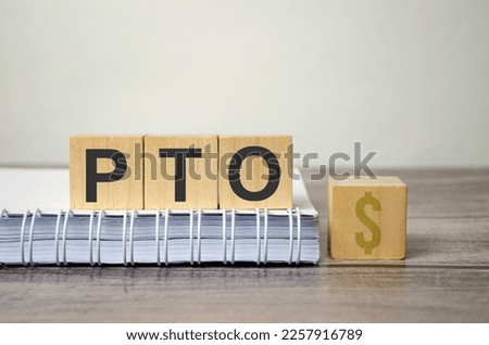 PTO, Paid time off symbol. Wooden blocks with concept words PTO, Paid time off Royalty-Free Stock Photo #2257916789