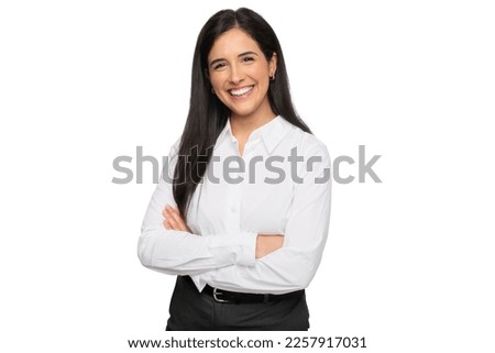 Friendly young business student, entrepreneur, with a charming smile, standing with arms folded against a white background