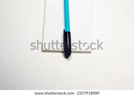 school notepad on blue background, spiral notepad on the table