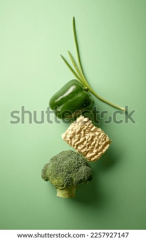various fresh produkts isolated on green background, top view