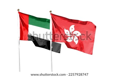 Hong Kong flag and United Arab Emirates flag on cloudy sky. waving in the sky
