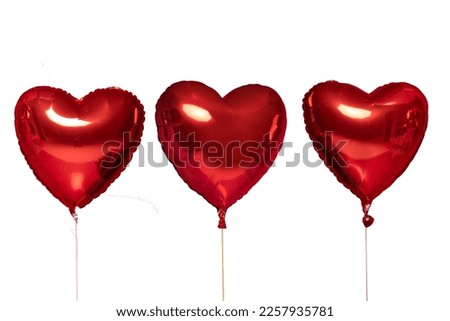 Metallic red heart balloons object for birthday party or valentines day isolated on a white background