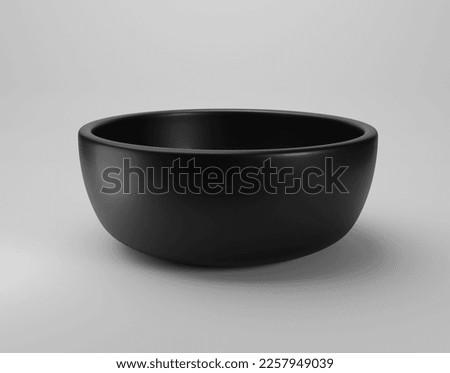 Empty black bowl on white background Royalty-Free Stock Photo #2257949039