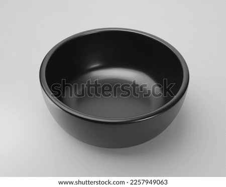 Empty black bowl on white background Royalty-Free Stock Photo #2257949063