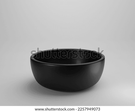 Empty black bowl on white background Royalty-Free Stock Photo #2257949073