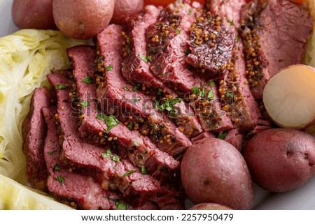 Corned beef with cabbage and potatoes on a serving platter, irish recipe idea for St Patricks day