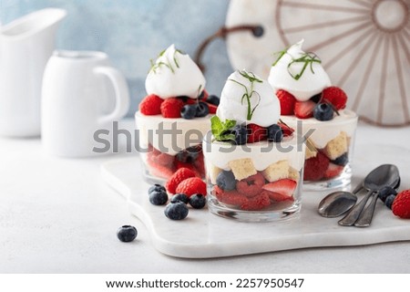 Berry pound cake trifle or parfait with cream cheese mousse and whipped cream, dessert in a glass idea Royalty-Free Stock Photo #2257950547