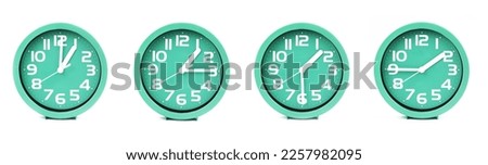close up of a set of green clocks showing the time; 1, 1.15, 1.30 and 1.45 p.m or a.m. Isolated on white background