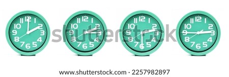 close up of a set of green clocks showing the time; 2, 2.15, 2.30 and 2.45 p.m or a.m. Isolated on white background Royalty-Free Stock Photo #2257982897
