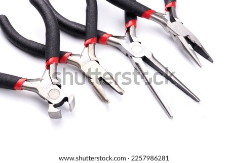 Set of different types of pliers and side cutters isolated on white background. Hand tools for repair, construction and maintenance Royalty-Free Stock Photo #2257986281