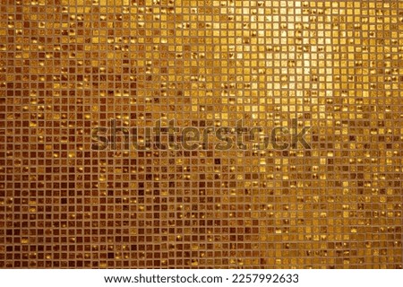 Small gold tile texture. Small golden tiles arranged to fit it into background. Golden tiled glasses mosaic background Royalty-Free Stock Photo #2257992633