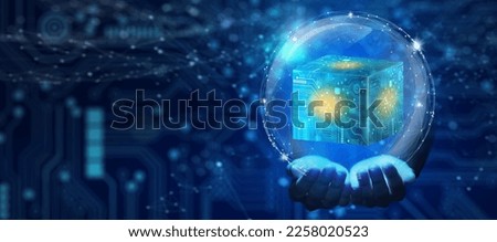 Businessman hand holding Cube technology with Abstract blue background. Blockchain Network System. Big data storage processing, Cloud data, Internet Security, and Digital Technology.