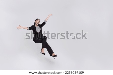 Young beautiful smiling asian businesswoman floating in mid-air and announcement something isolated on white background. Royalty-Free Stock Photo #2258039109