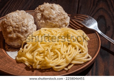 Pasta with meatballs on a plate. Background picture.