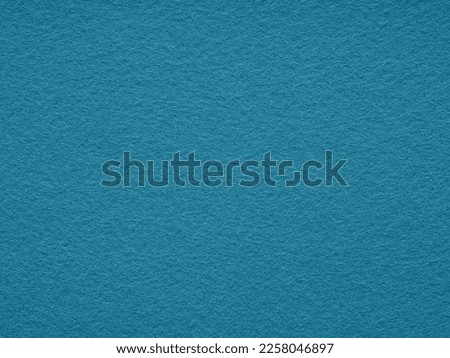 Texture of soft blue felt material close-up. Full frame retro, vintage pattern. Saturated background for Christmas desktop, holiday New Year, xmas seasonal decoration, lettering, patchwork.
