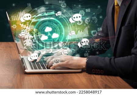 Business hand typing on a modern laptop